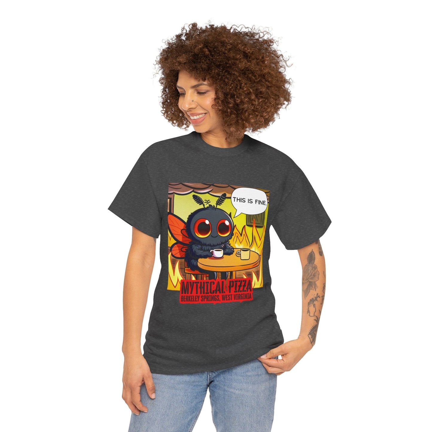 A woman wears a gray t-shirt with a "This Is Fine" meme design and jeans.